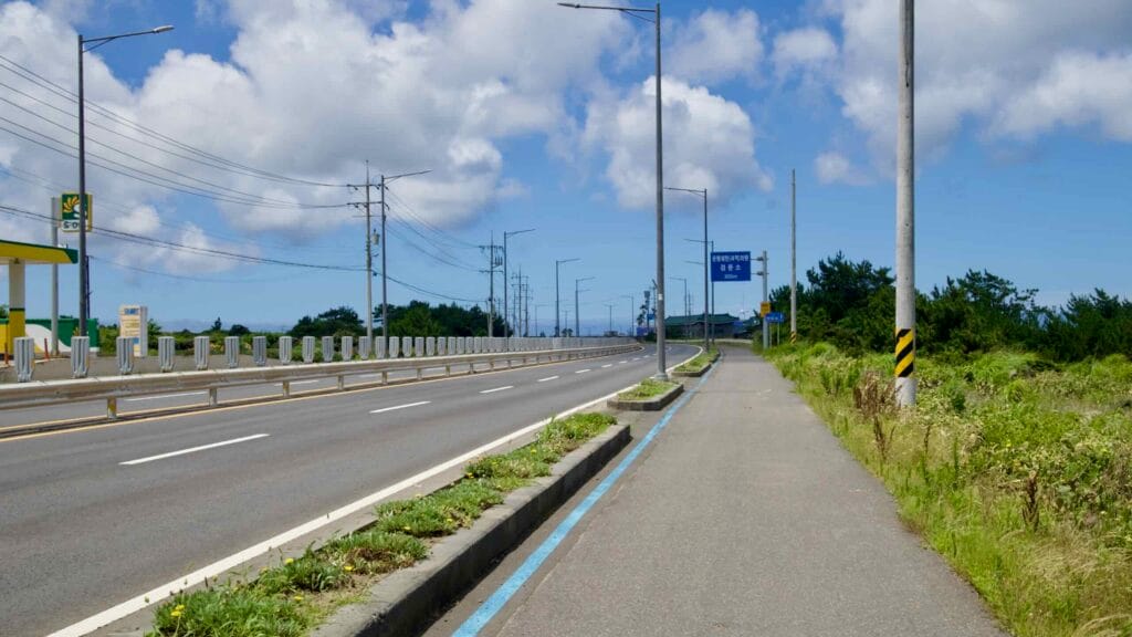 Coastal highway and blue bike path near Woldeok‑ri.
