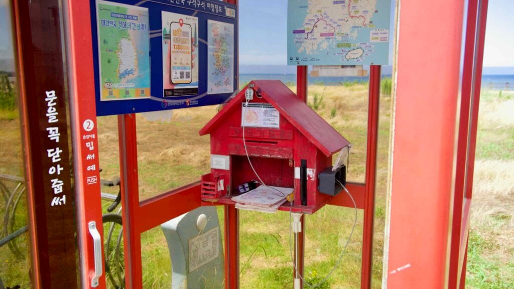 Stamp box and maps inside the Haegeoreum Park cycle shelter.
