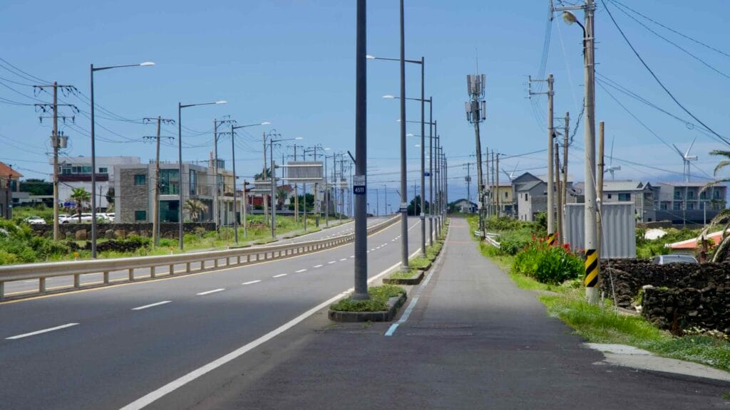 Iljuseo Road with a parallel bike path near Sinchang, Jeju’s west coast.