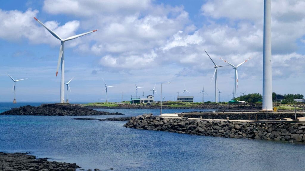 Offshore and onshore turbines near homes and seawalls at Sinchang.