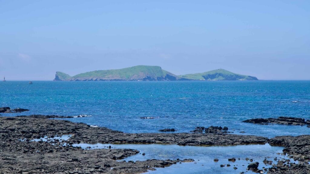 Chagwido seen past tidal flats and lava rock on Jeju’s west coast.