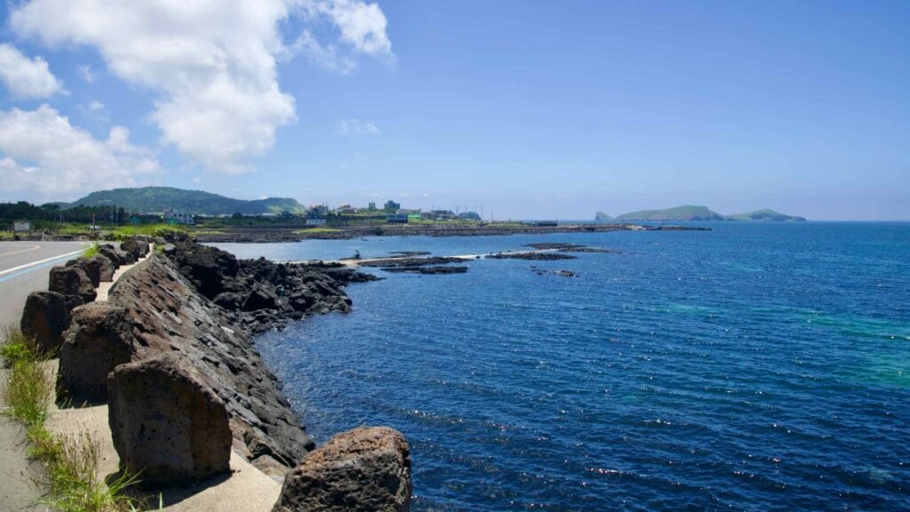 Lava shelves and blue water with Chagwido offshore.