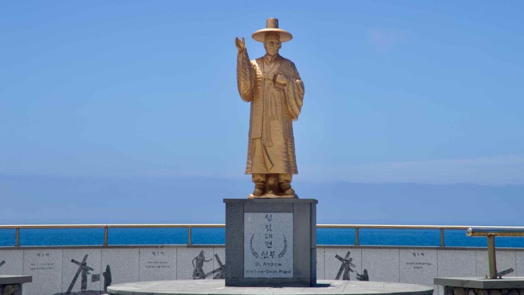 St. Andrew Kim Dae‑geon statue on Yongsu’s seafront.