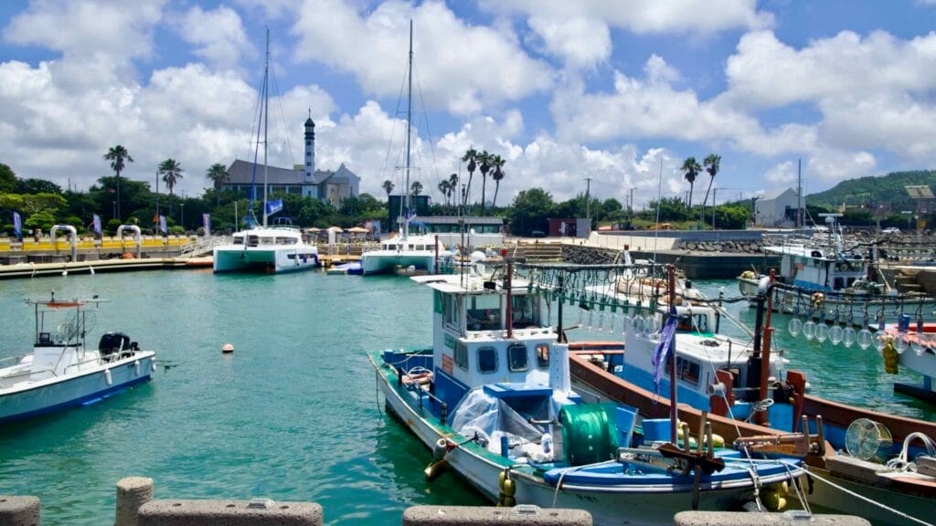Boats at Yongsu Port with St. Kim Dae‑geon Memorial Church behind.