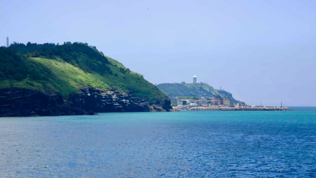 Green cliffs leading toward Suwolbong and the radar dome.