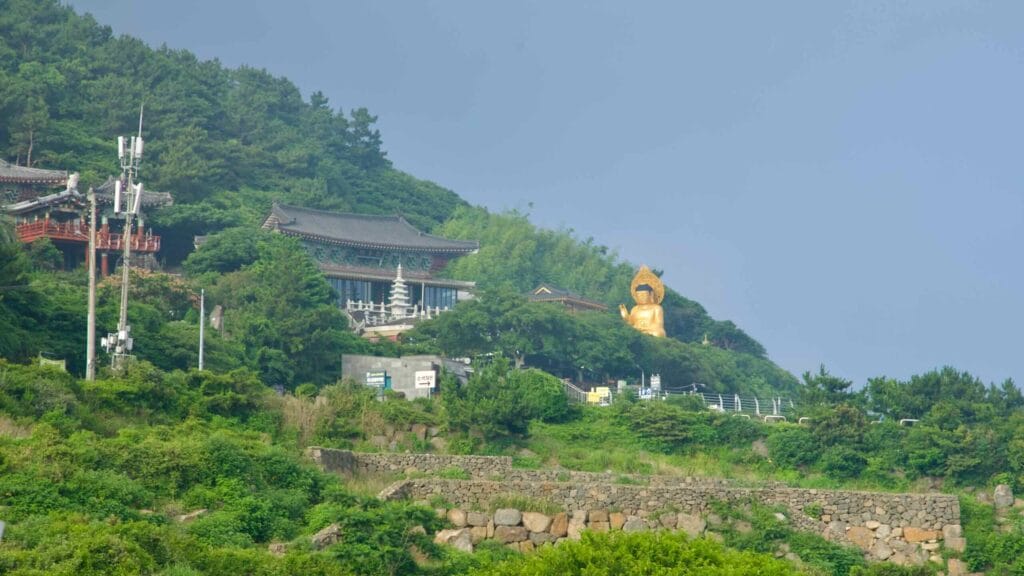 Golden Buddha beside the halls of Bomunsa Temple.