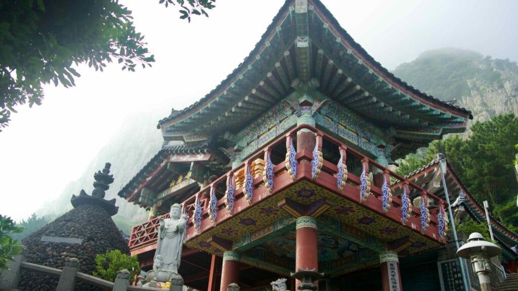 Intricate dancheong patterns under the pavilion eaves at Bomunsa Temple.
