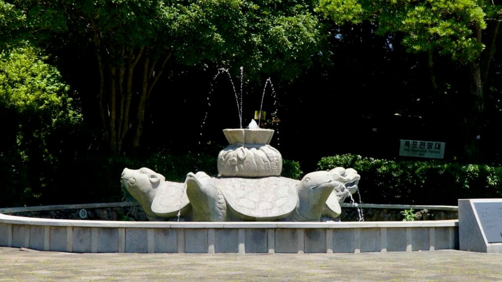 Turtle fountain spraying in the plaza near Cheonjeru Pavilion at Cheonjeyeon.
