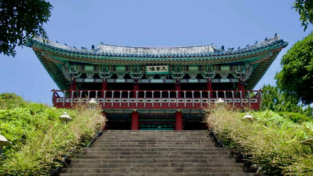 Cheonjeru Pavilion above the wide basalt stairway at Cheonjeyeon.