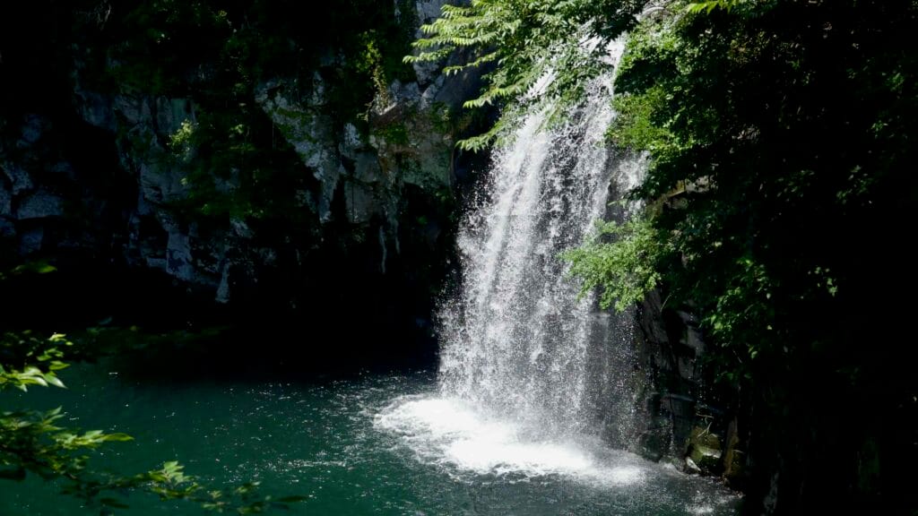 Cheonjeyeon’s third waterfall plunges into a deep green pool.