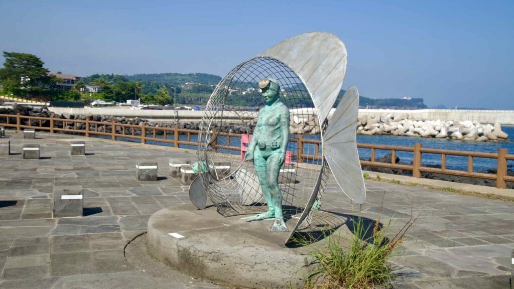 A statue of a haenyeo diver stands at Jamnyeo Square in Beophwan.