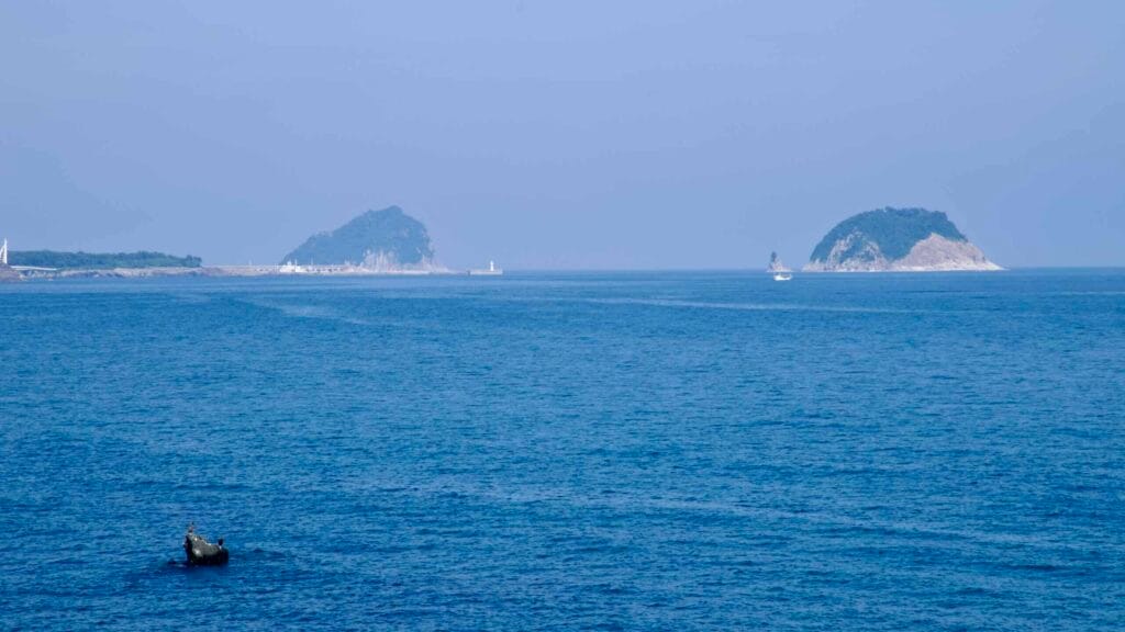 Munseom and Beomseom islands rise offshore from Seogwipo.