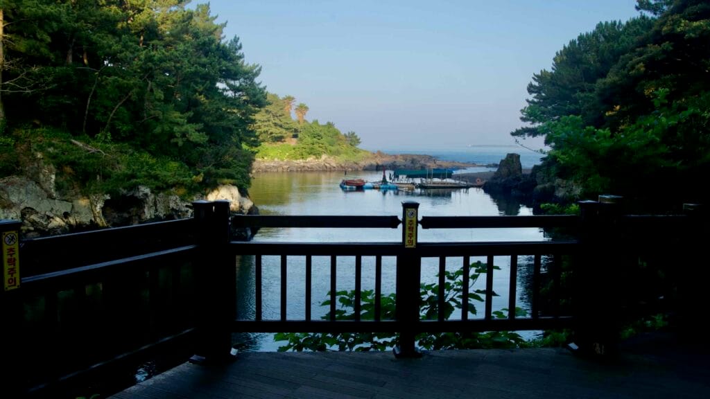 The calm estuary at Soesokkak opens to the sea, seen from a shaded viewing deck.