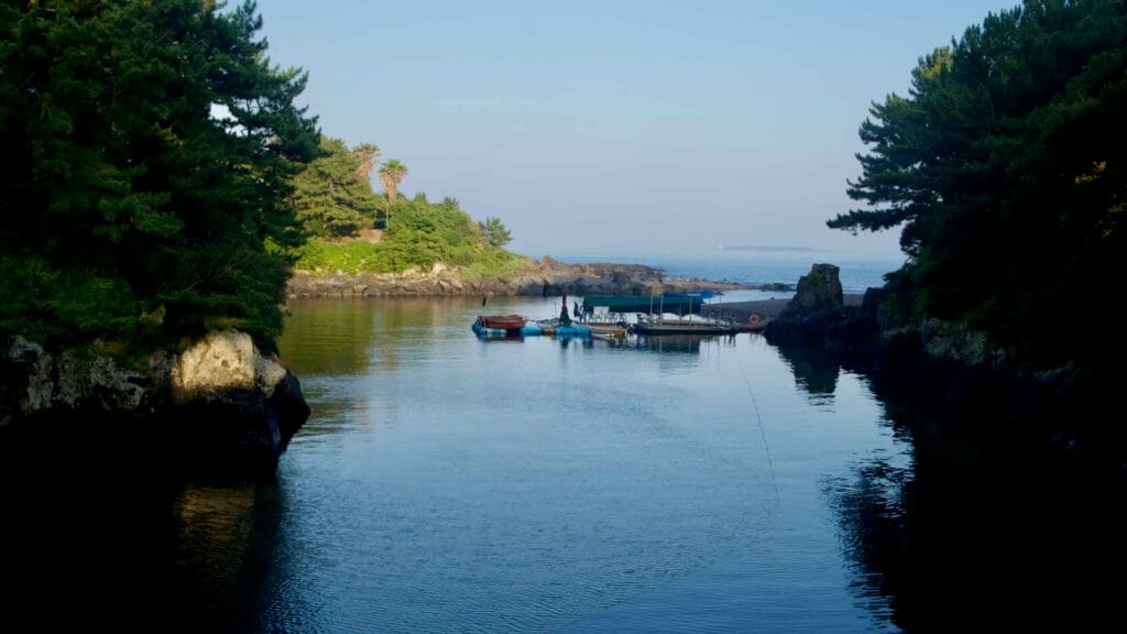 Small boats and a floating dock sit where the Soesokkak estuary opens to the sea.