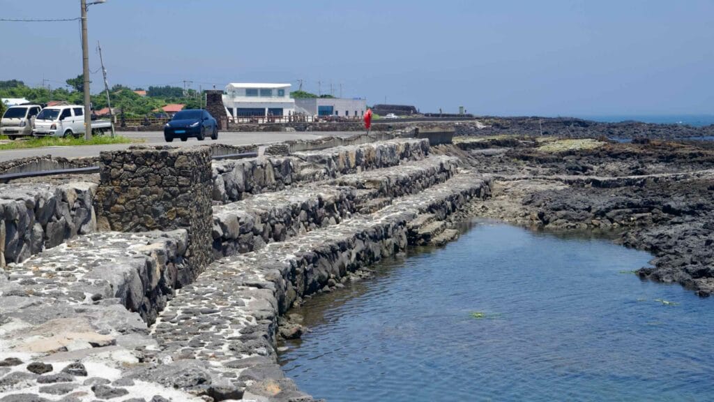 Stepped seawalls shape narrow inlets along the Onpyeong shore.