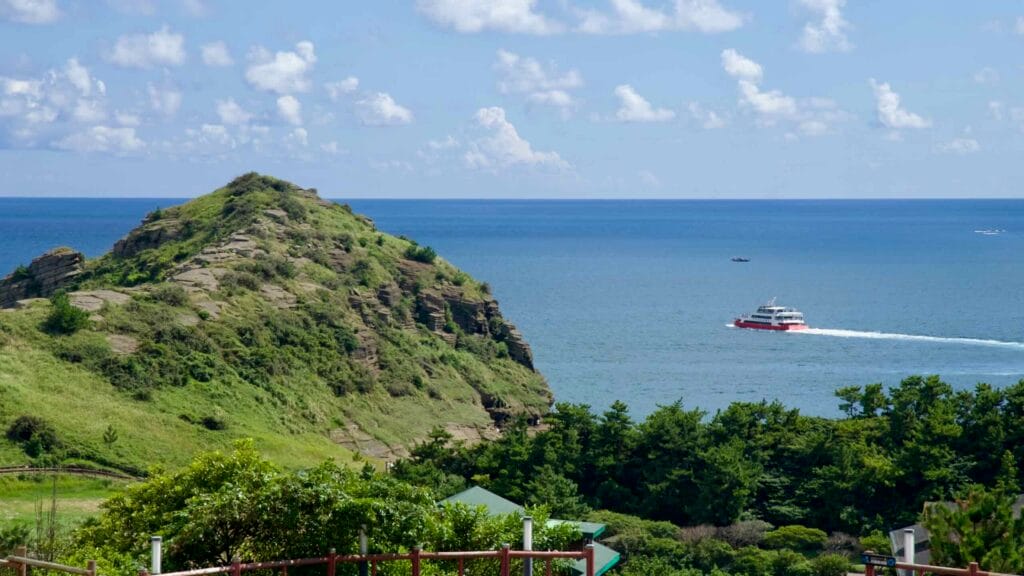 Passenger ferry passing Yongmeori Coast headland.