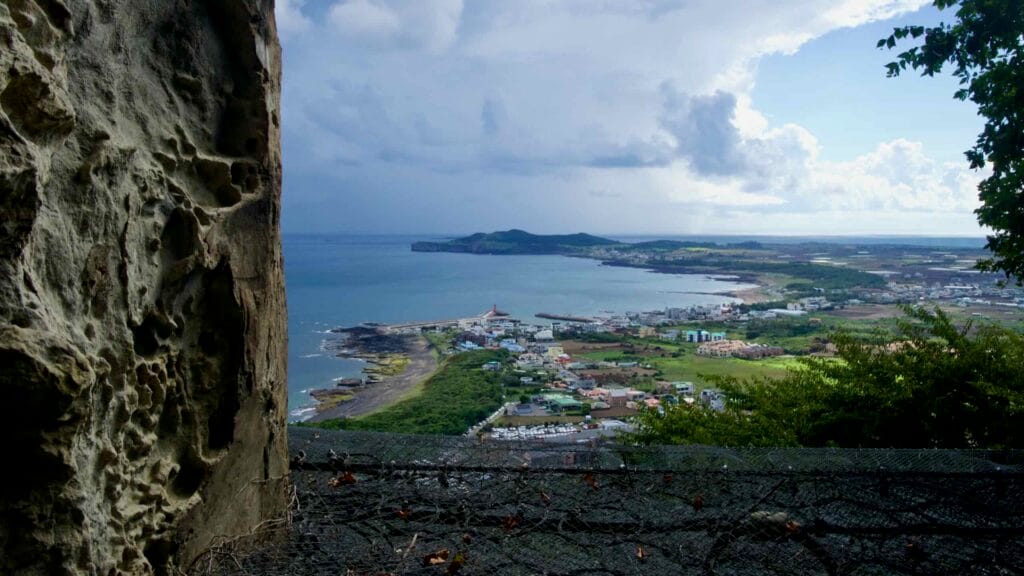 Panoramic view from Sanbanggulsa Temple of the coast and farmland.