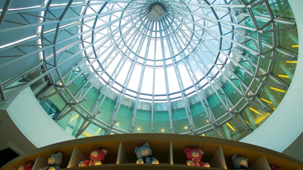View of Teddy Bear Museum’s glass dome ceiling with radiating steel beams.