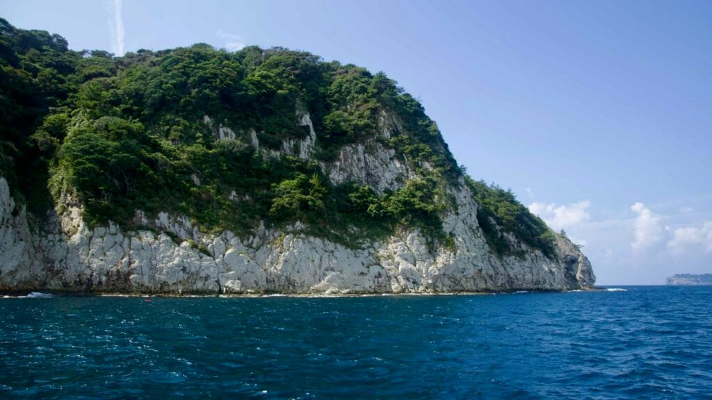 Munseom Island stands low on the horizon beneath summer clouds.