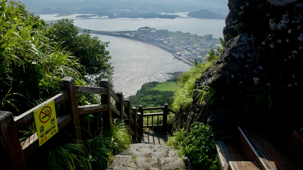 Stone steps and wooden railings descend along Seongsan Ilchulbong’s final ascent.
