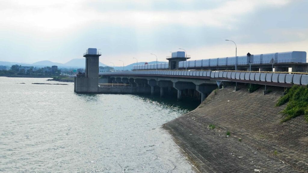 Hando Bridge carries the coastal road over a tidal channel beside Seongsan Village.