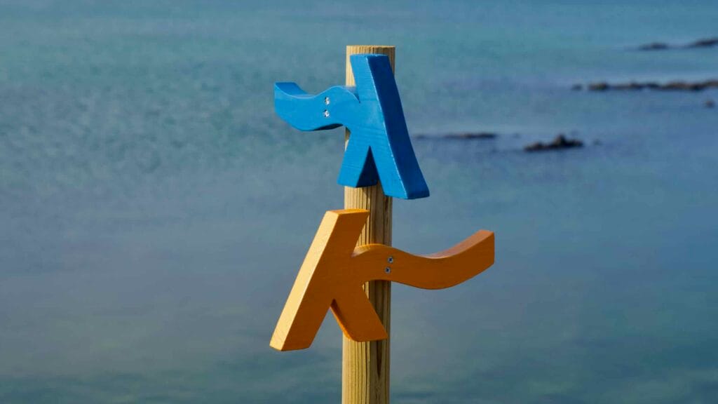 Blue and orange bird markers point the way along the scenic waterfront trail.