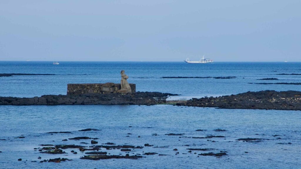 Seongsan Ilchulbong stands across the narrow channel from Dumun Port.