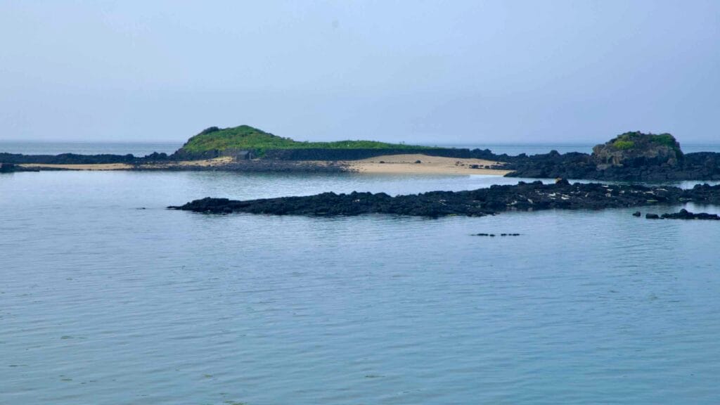 Tokkiseom’s low islet and narrow sandbar sit just offshore from Hado Beach.