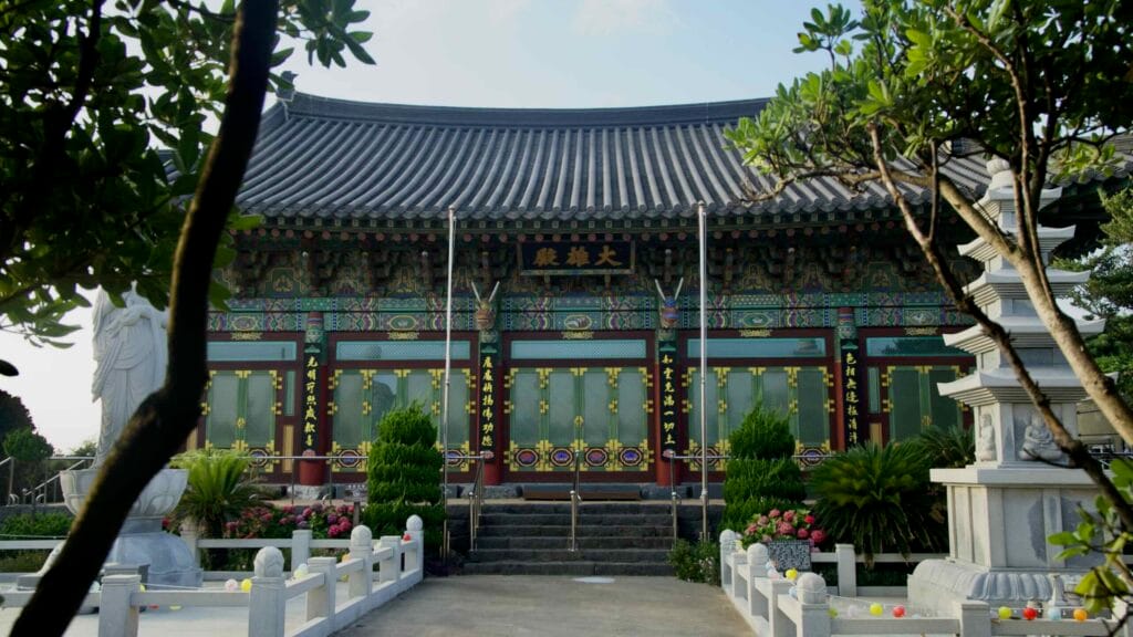The courtyard frames the Daeungjeon main hall within the serene grounds of Yongmunsa Temple.