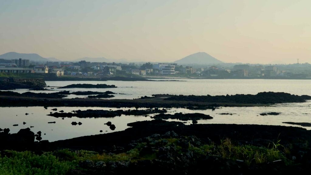 Basalt flats stretch toward Sehwa with Jimibong Peak faint on the far horizon.