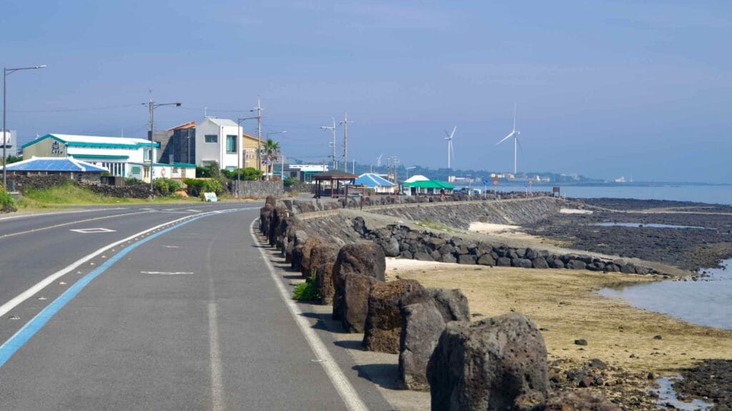 A seafront bikeway skirts the Handong-ri waterfront above the lava flats.