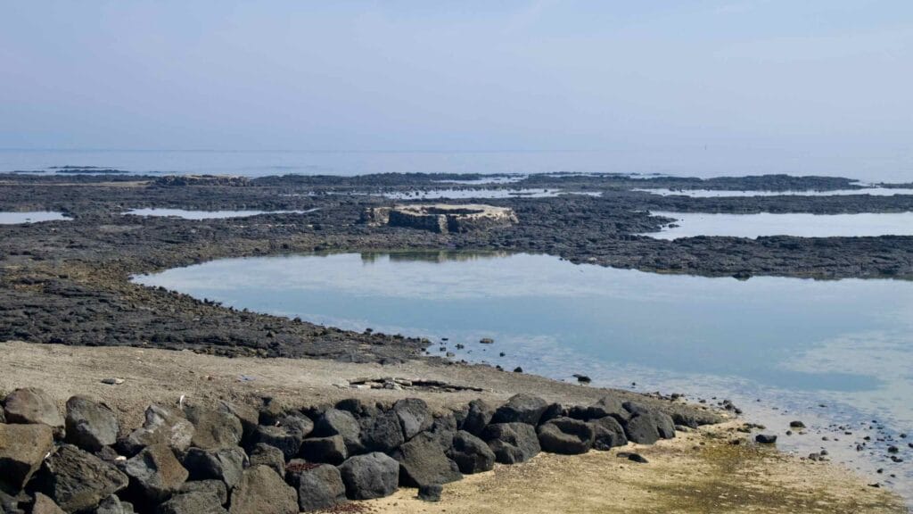 Tidal pools encircle the Geoseunmul spring basin on the Handong coast.