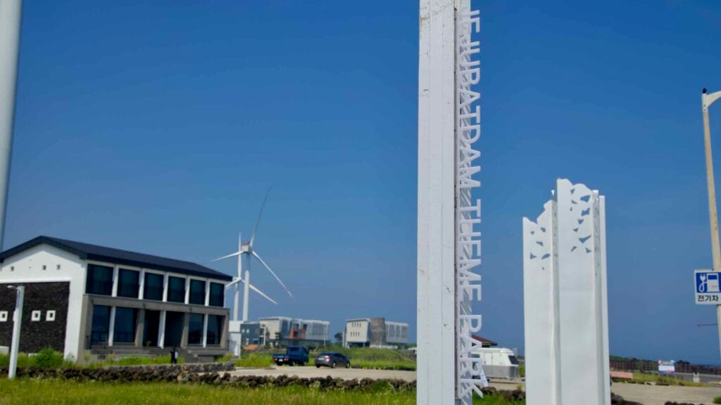 The Jeju Batdam Theme Park sign stands by the exhibition hall.