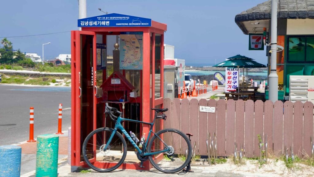 Road bike rests at the Gimnyeong Seongsegi Beach Certification Center booth.