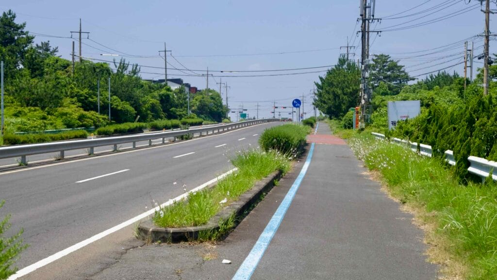 A blue-striped bike lane follows Iljudong-ro near Bukchon.