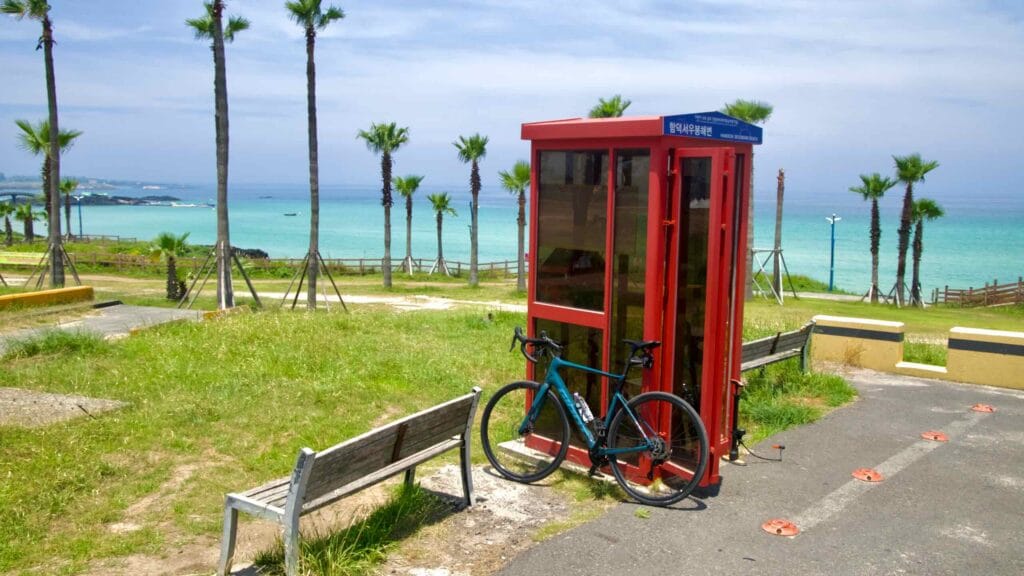 A red certification booth stands above Hamdeok Seoubong Beach.