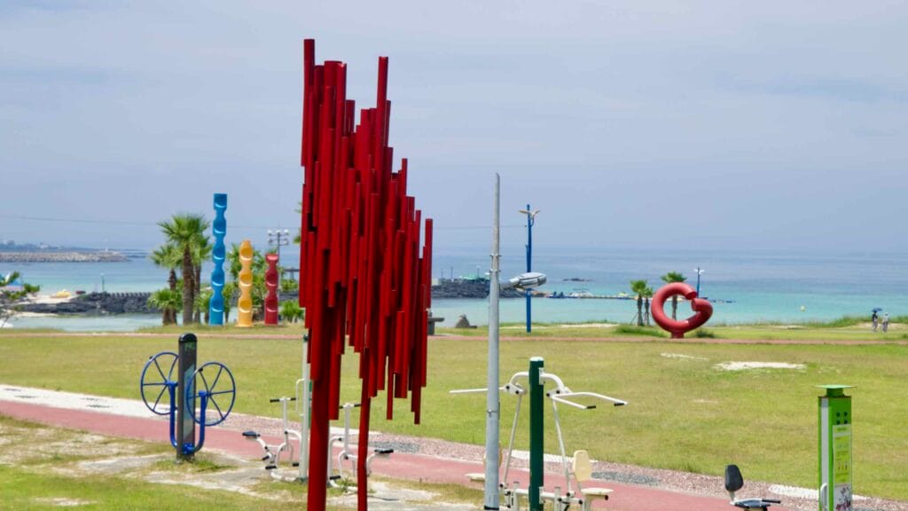 Colorful vertical sculptures at Hamdeok Seoubong Beach.