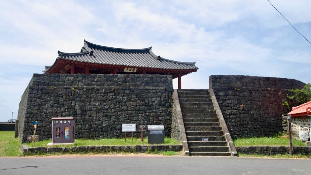 Yeonbukjeong Pavilion stands on a basalt bastion at Jocheon, its roof overlooking the harbor.