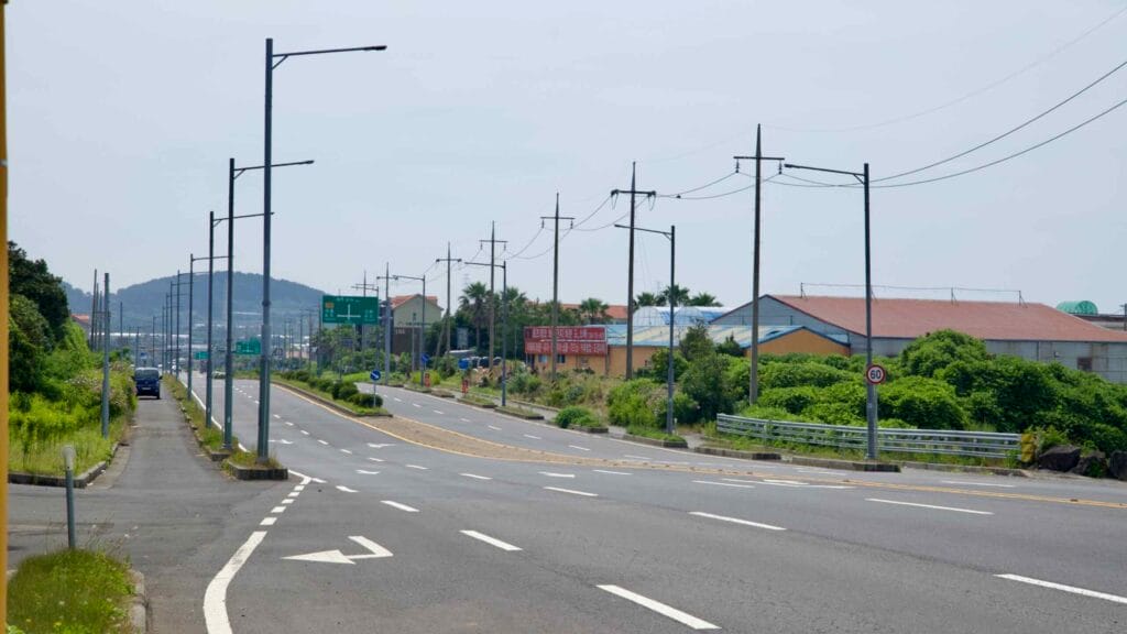 A multi-lane stretch of Iljudong-ro heads toward low hills near Samyang.