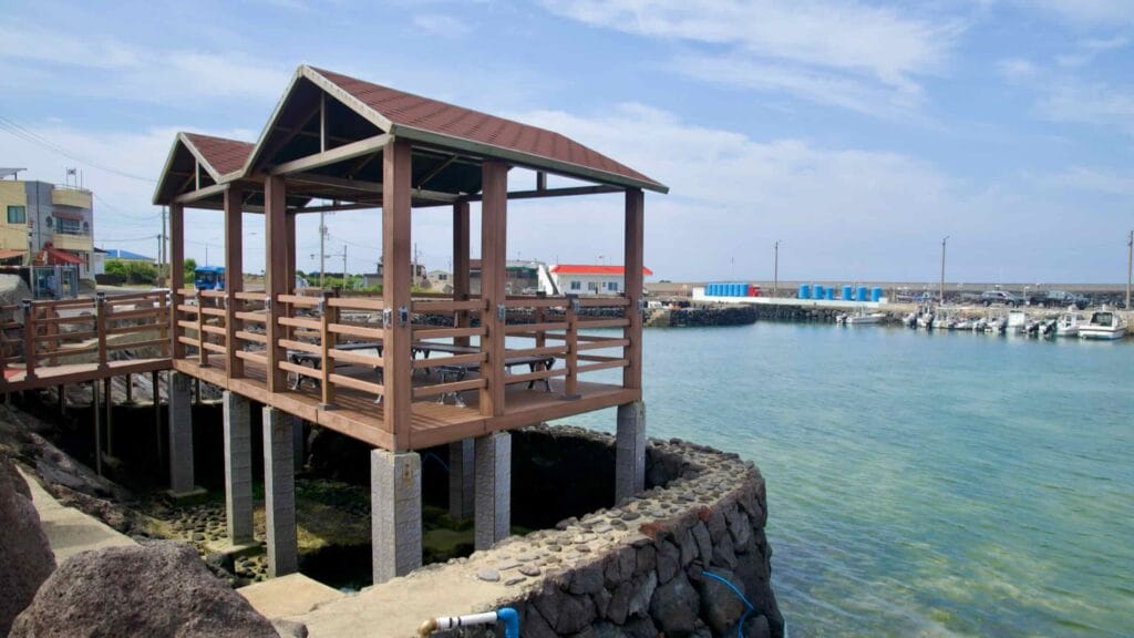 A wooden waterside pavilion on stilts overlooks Beollang Port.