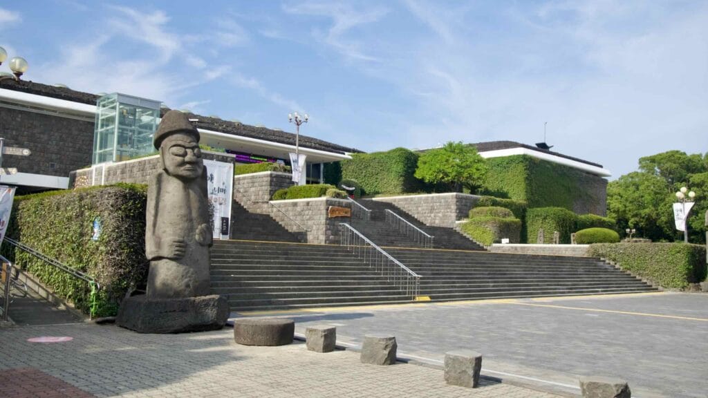 A wide view shows the terraced entrance and stairs of the museum.
