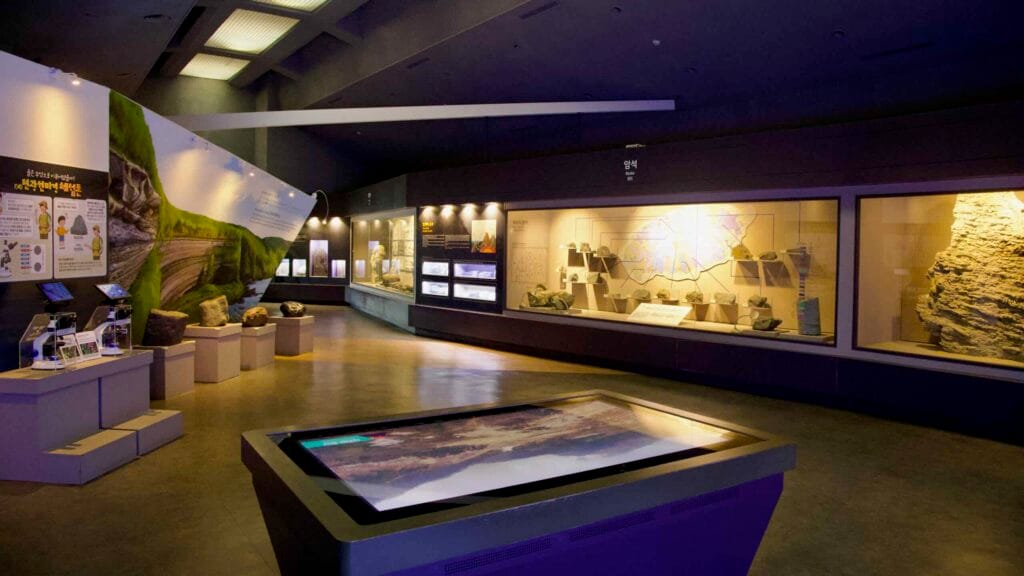 The geology gallery as a large interactive table introduces Jeju’s volcanic landforms.