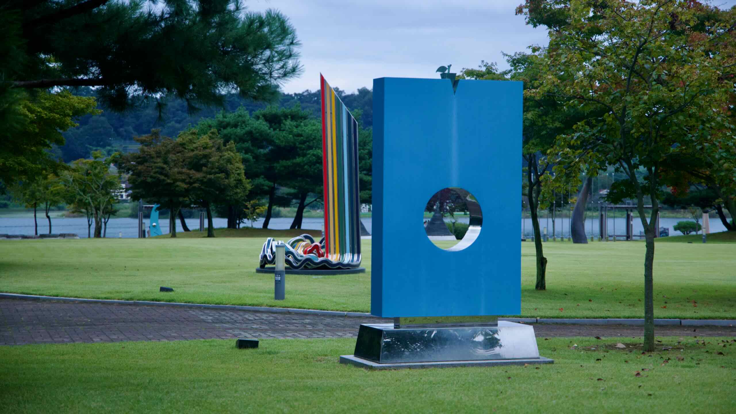 Contemporary sculptures are displayed on the lawns at Jungangtap Park beside the South Han River.