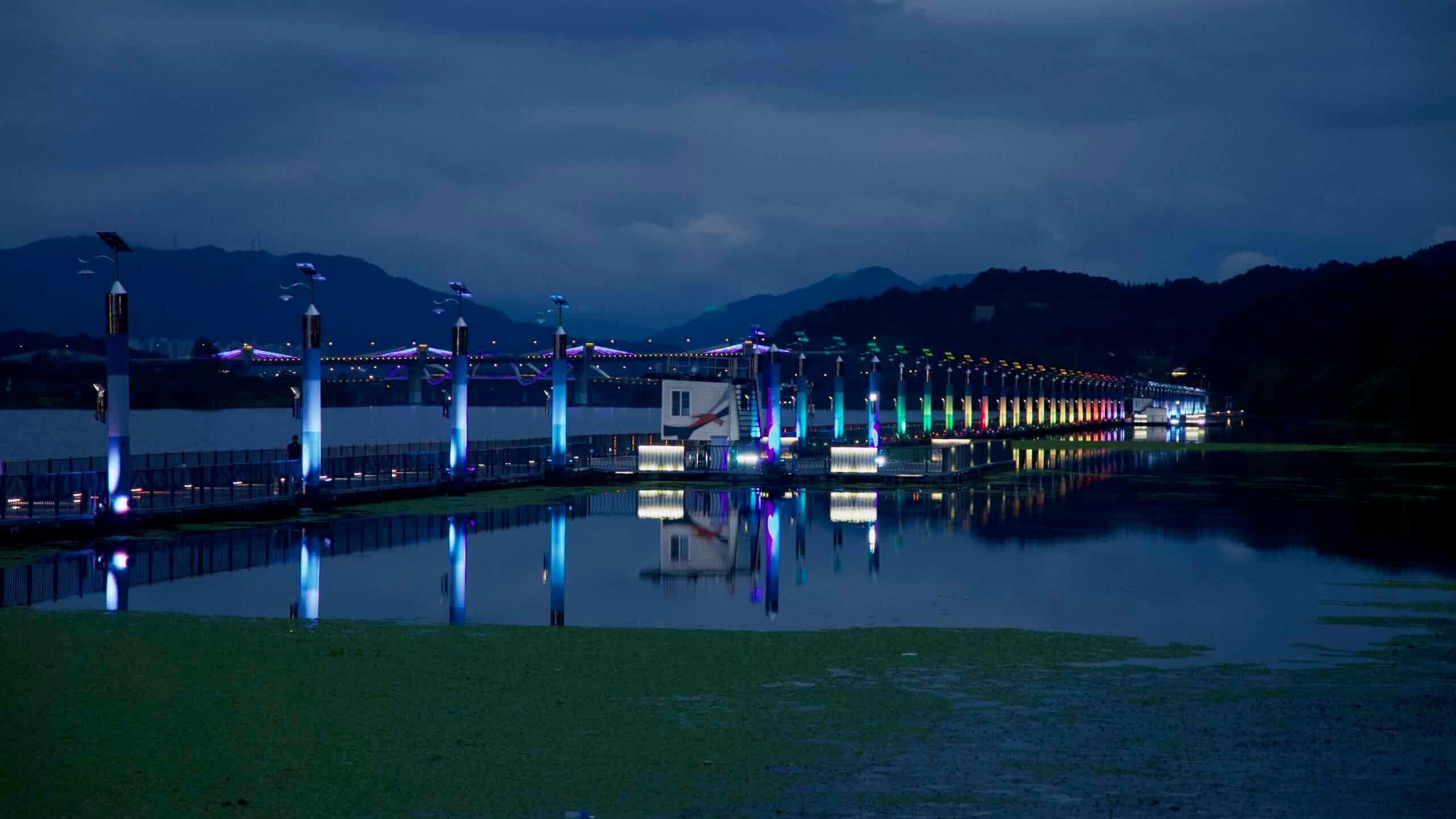 Color-changing LED pillars light the floating Rainbow Bridge near Jungangtap Park.