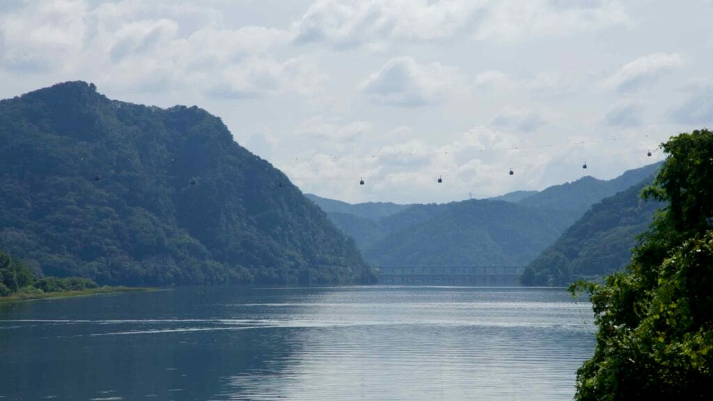 Gondola cabins cross the gorge above the Bukhangang near Uiam Lake.