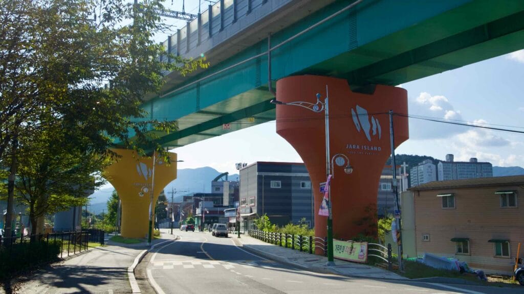 Jara Island–branded columns carry the Gyeongchun Line viaduct at the island entrance.
