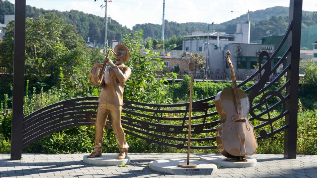 Bronze jazz figures and a musical staff sculpture stand near Jara Island in Gapyeong.