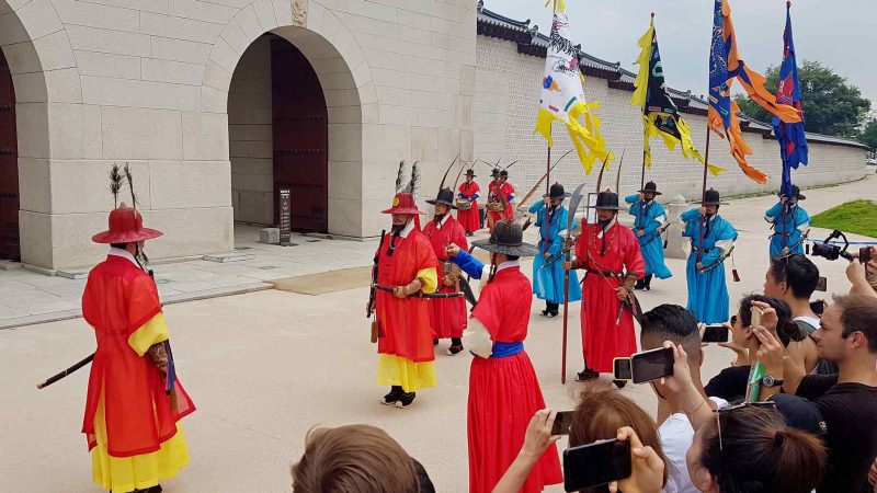 The changing of the guard ceremony in from of Gyeongbuk Palace.